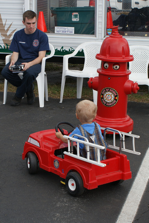 Fire Fighter pulling up to the hydrant